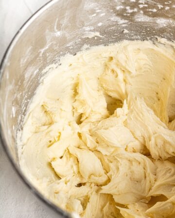 Filling ingredients for pies combined in stand mixer bowl.