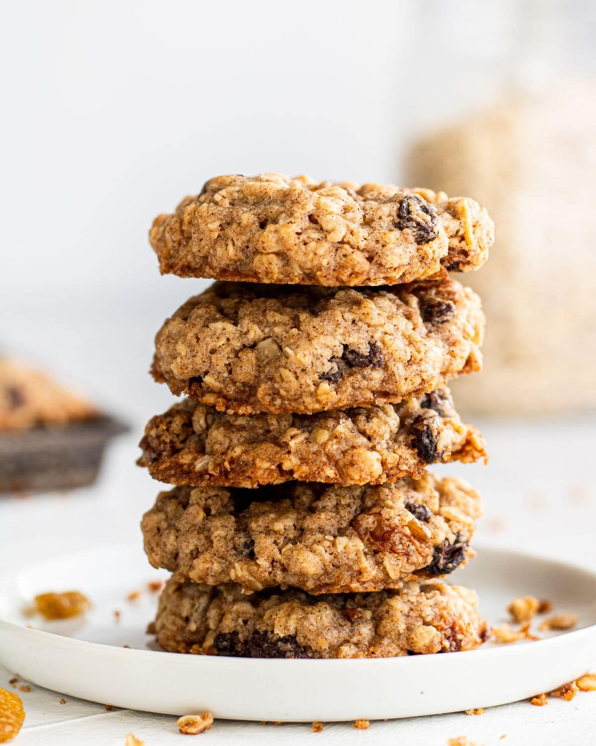 Close up side view of finished cookies stacked on each other on a plate. 