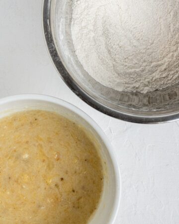 Two bowls with wet and dry ingredients combined.