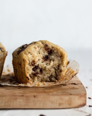Close up view of muffin with a bite out of it.