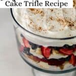 Close up view of trifle in glass trifle dish pin with text overlay.