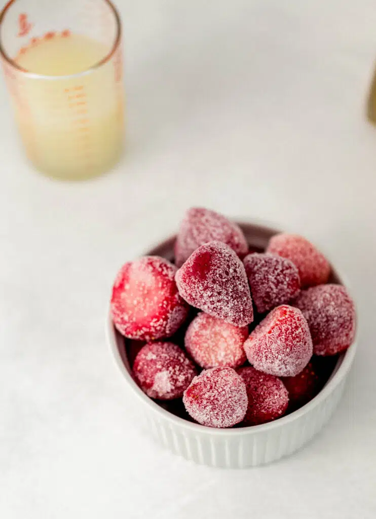 white bowl of frozen strawberries 