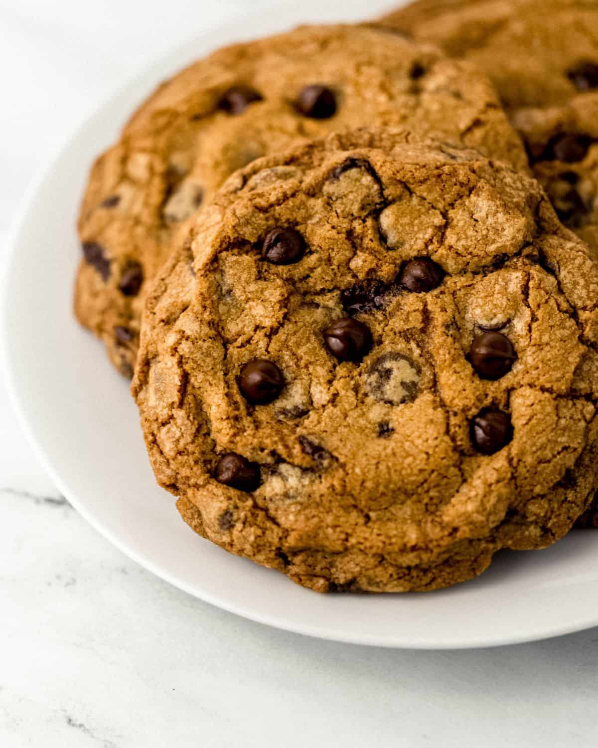 Close up view of cookies on white plate.