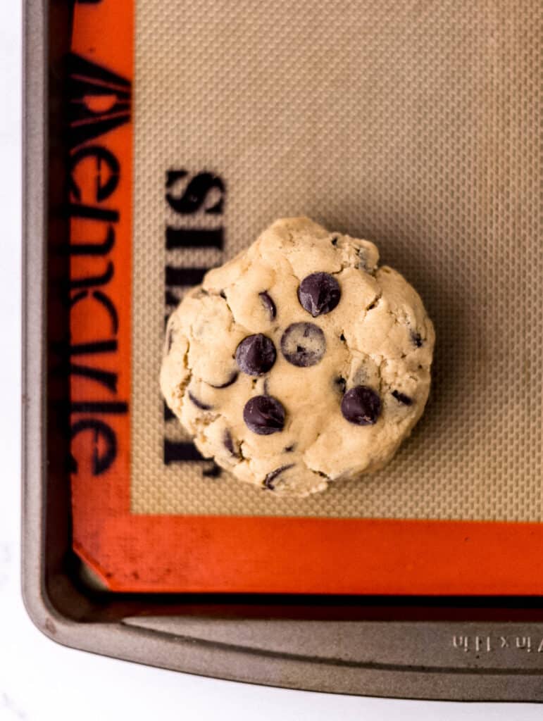 flatten cookie dough on baking sheet lined with nonstick liner