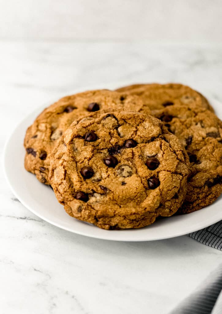 close up side view large cookies on white plate