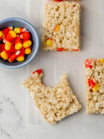 rice krispie treats with small blue bowl with candy corn