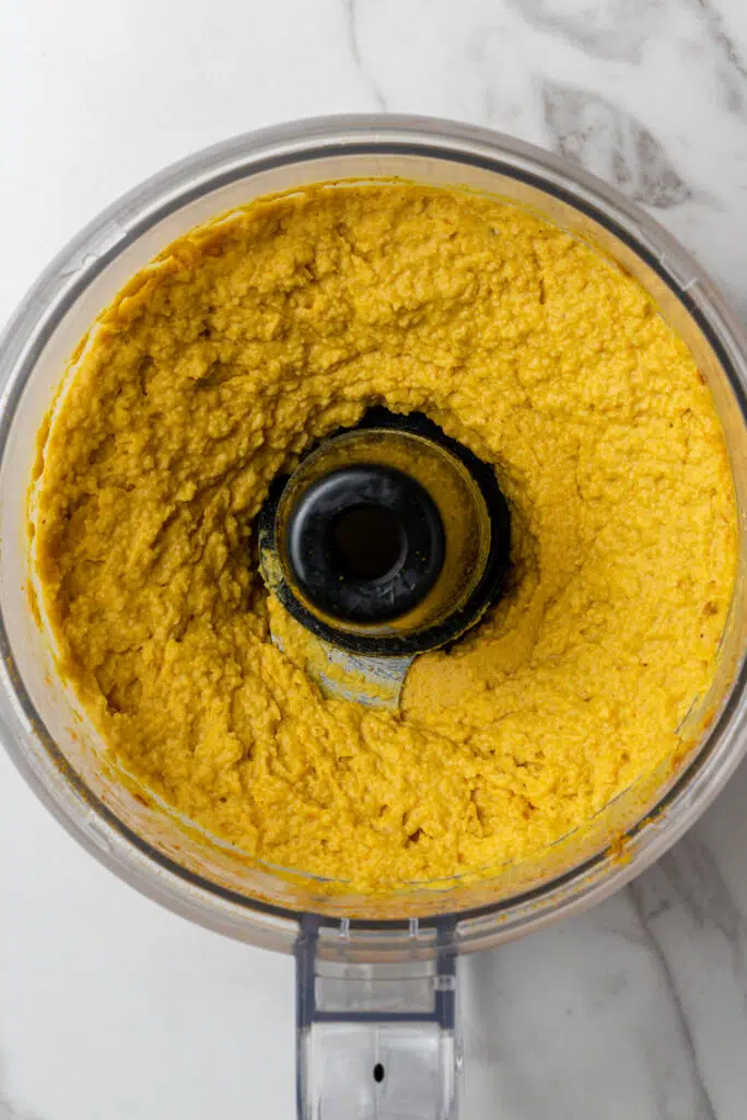 processed hummus mixture in food processor 