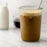 Side view of finished espresso in glass.
