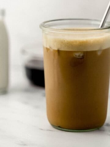 Side view of finished espresso in glass.