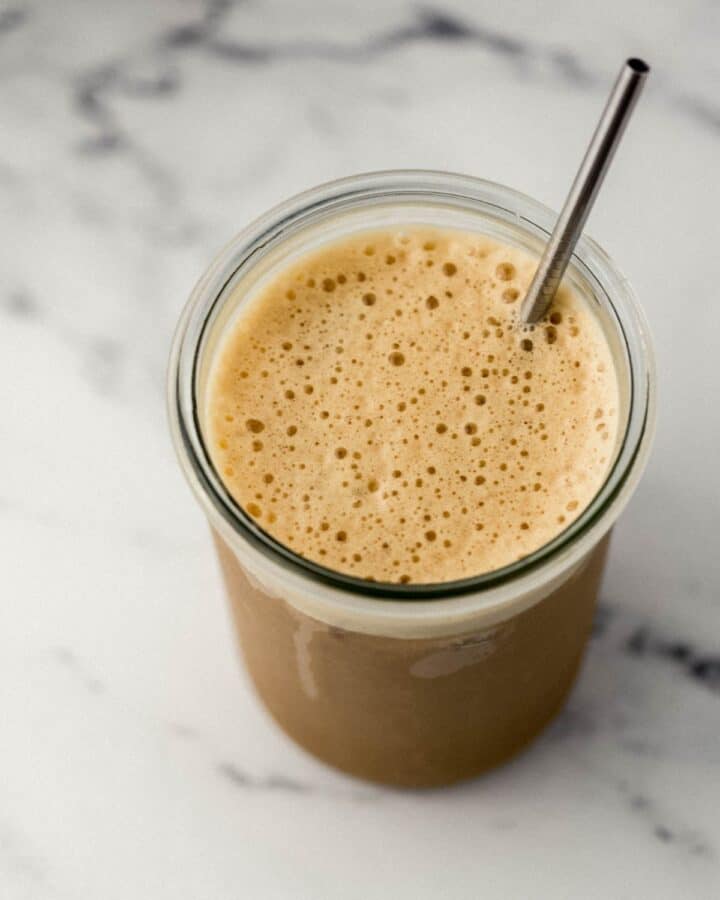 Close up of shaken espresso in glass. 