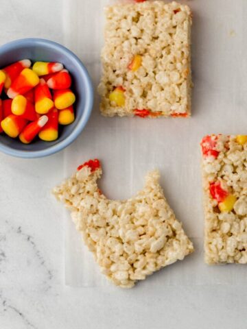 rice krispie treats with small blue bowl with candy corn
