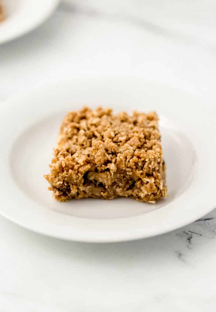close up side view apple bar on white plate