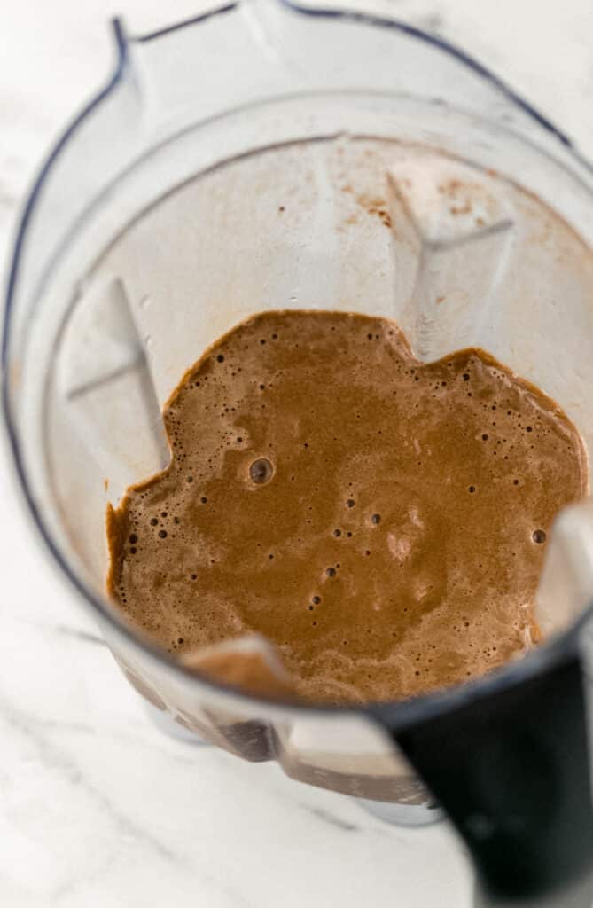 mocha smoothie ingredients blended together in blender pitcher 