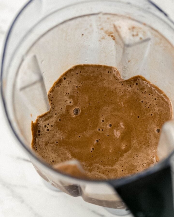 Smoothie ingredients combined in blender. 