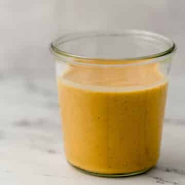 side view ginger salad dressing in jar