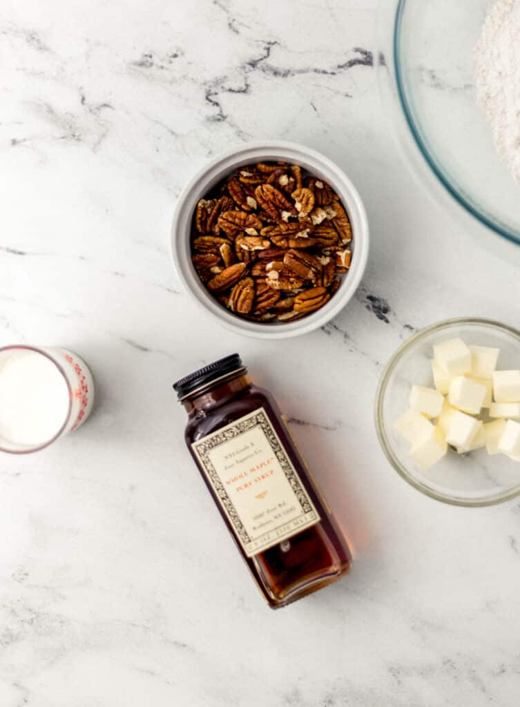 ingredients to make maple pecan scones on marble surface