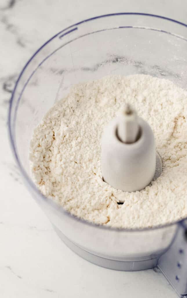 flour, baking powder, butter, and salt in food processor
