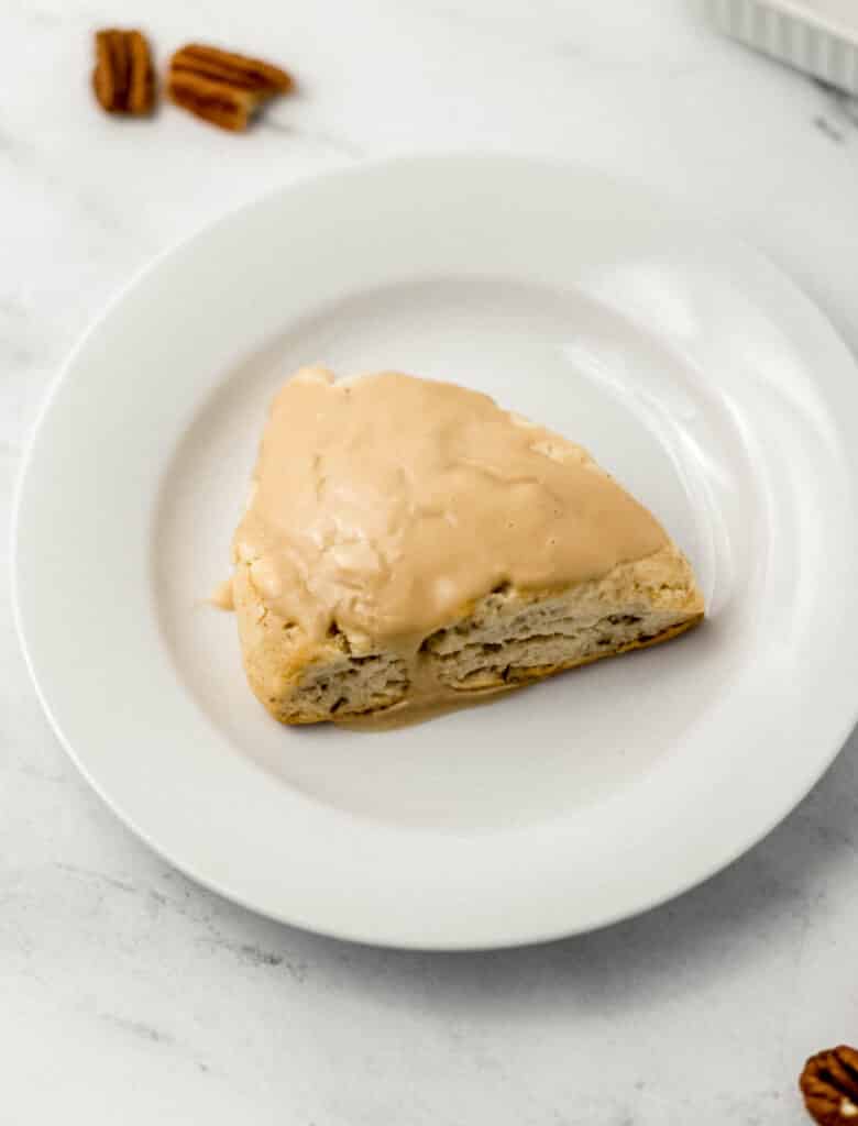 single finished scone on small white plate