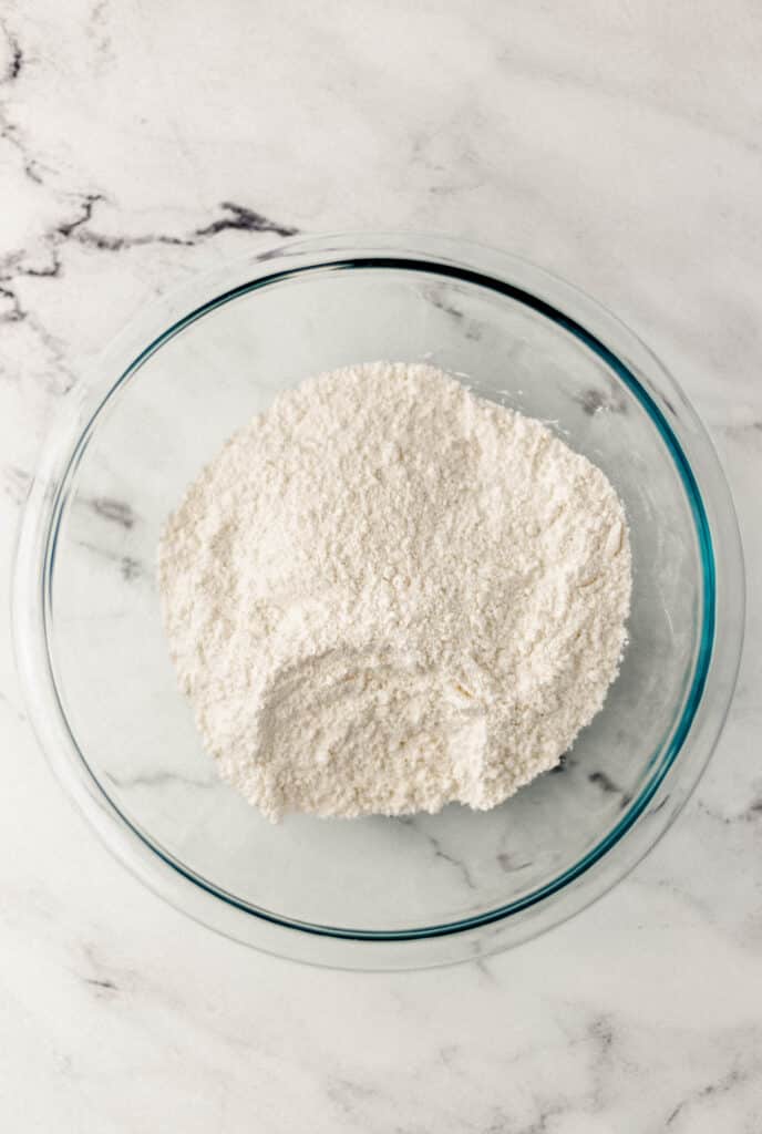 dry ingredients for muffins in glass mixing bowl 