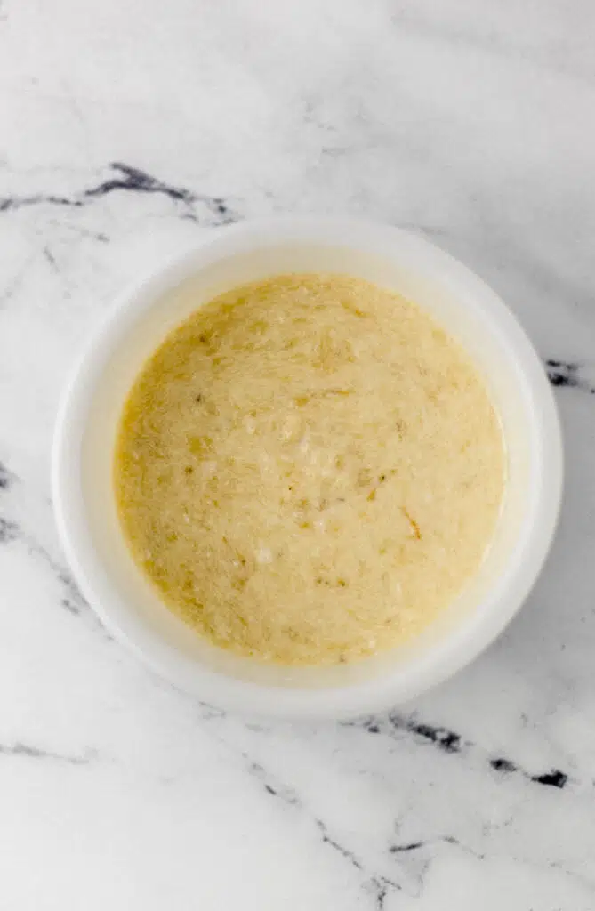 wet ingredients for muffins combined in white bowl 