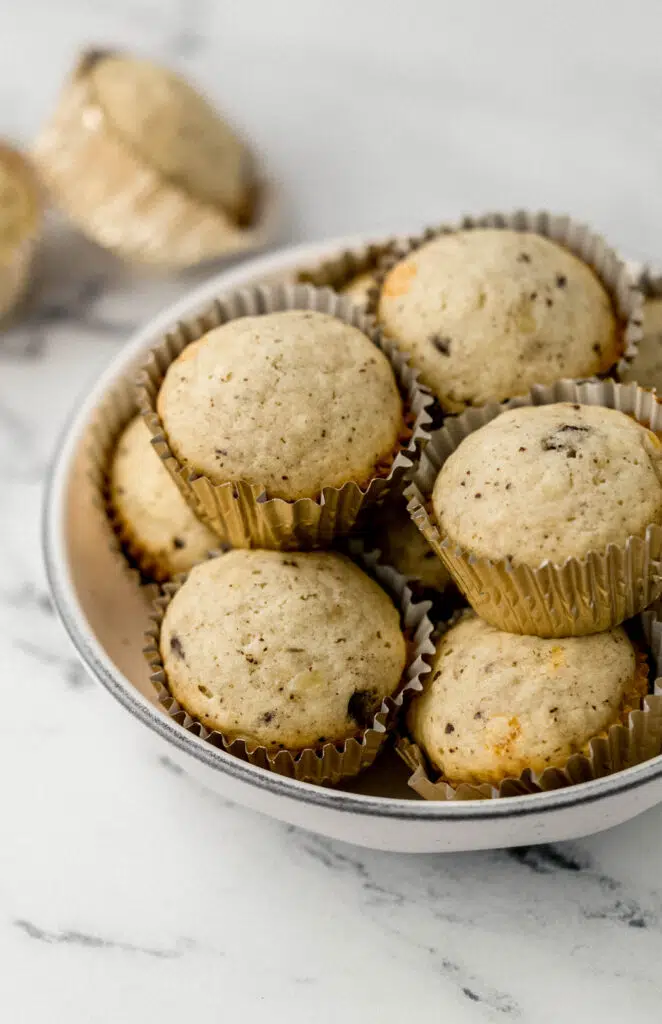 muffins stacked on top of each other in white bowl 