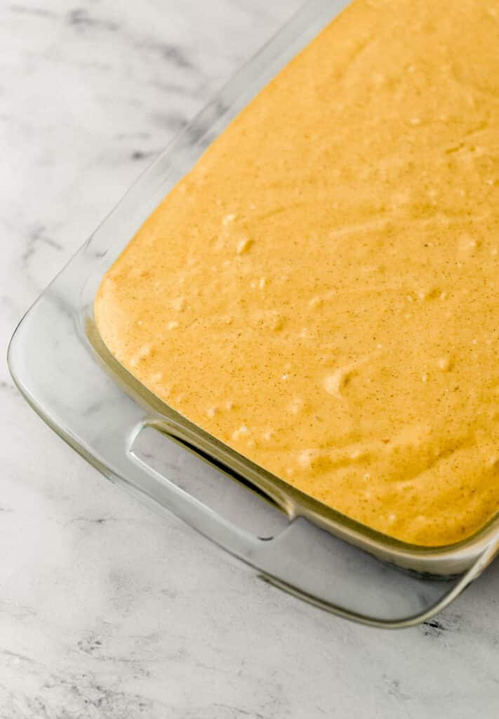 cheesecake in glass baking dish before baking 