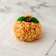 Close up view of single rice krispie treat on parchment paper.