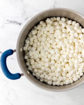 Mini marshmallows and melted butter in a larger pot.
