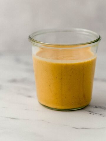 side view ginger salad dressing in jar