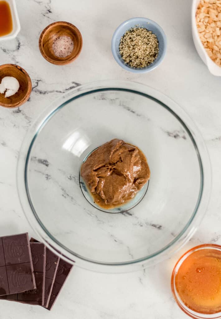 overhead view crispy rice treat in separate containers on marble surface