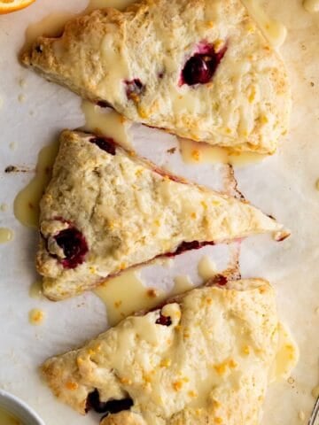 Overhead view of finished scones topped with glaze.