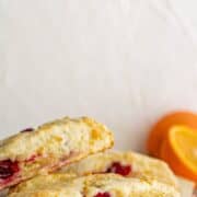 Close up side view pic of scones on pin with text overlay.