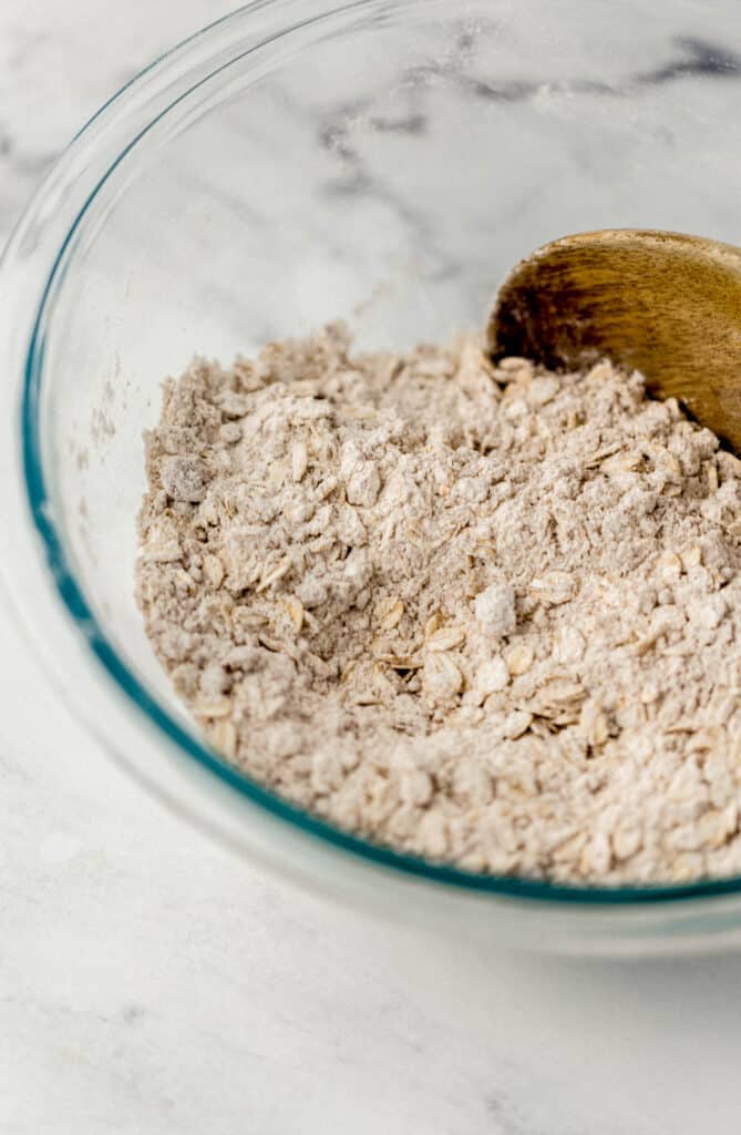 ingredients for crisp topping combined in glass mixing bowl
