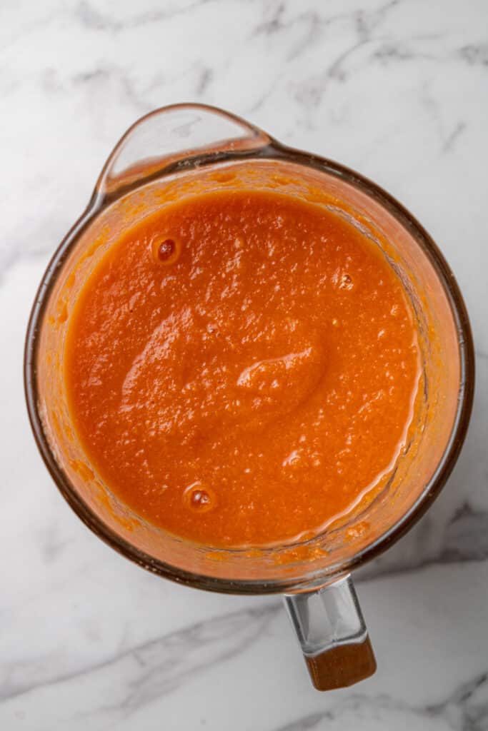 tomato soup in large glass pitcher