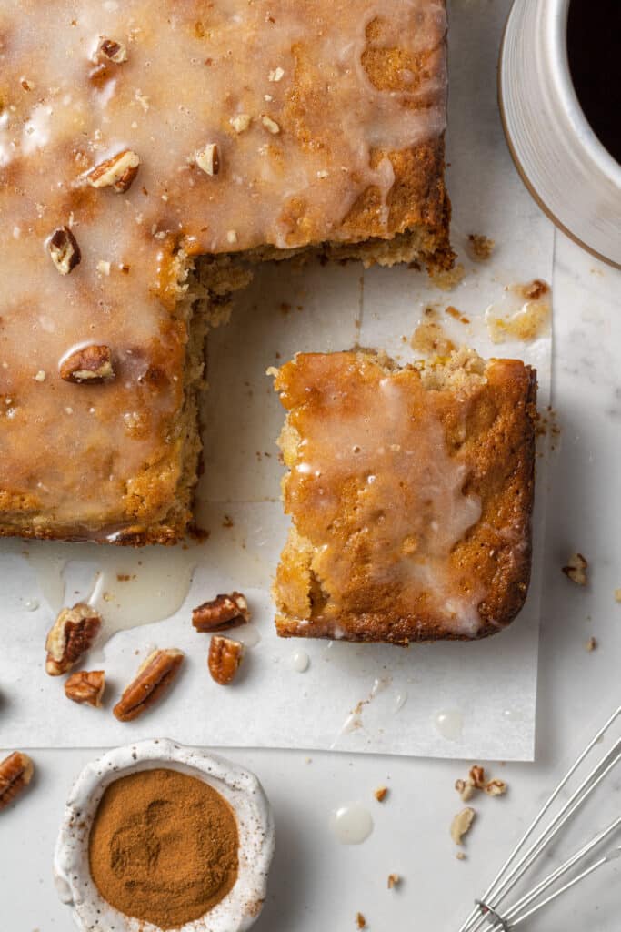 overhead view of hummingbird coffee cake with piece cut out of it