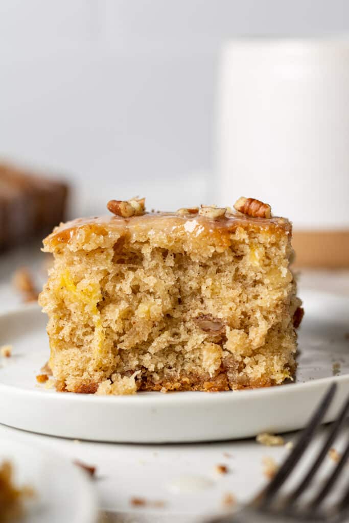 close up side view slice of coffee cake on white plate 