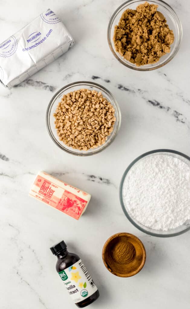 overhead photo of ingredients needed to make toffee snickerdoodle dip in separate containers. 