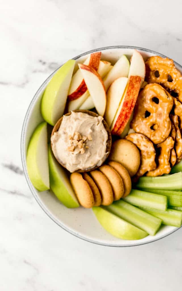 snack bowl with toffee snickerdoodle dip in small wooden bowl 