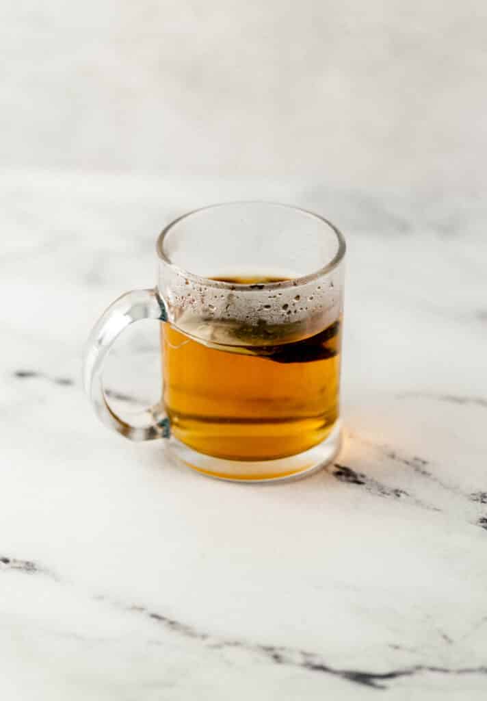 mint tea steeping in a glass mug