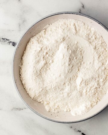 Dry cobbler ingredients combined in large bowl.