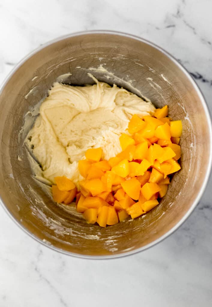 peach bread mixture and diced peaches in large mixing bowl