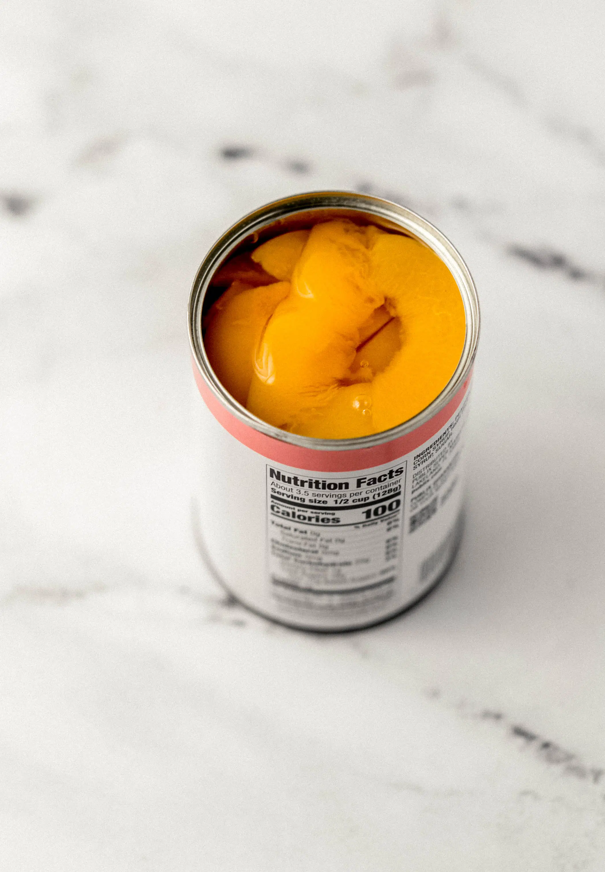open can of sliced cling peaches