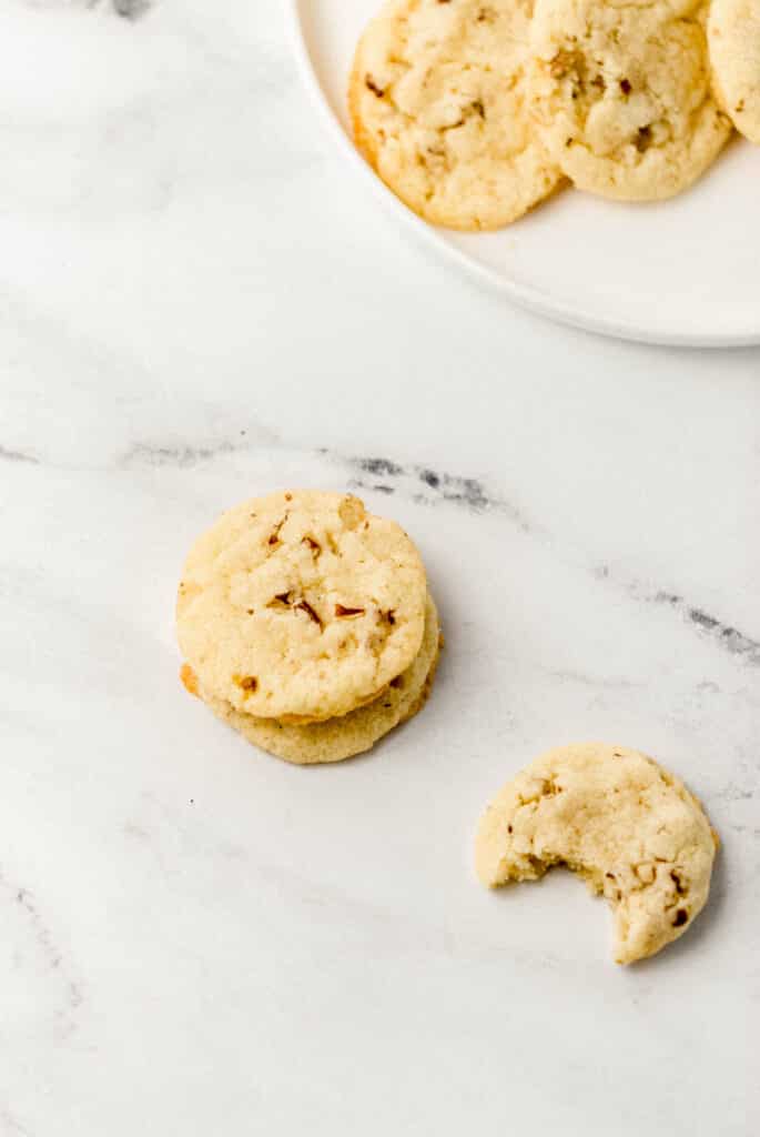 pecan cookies on white plate and marble surface 