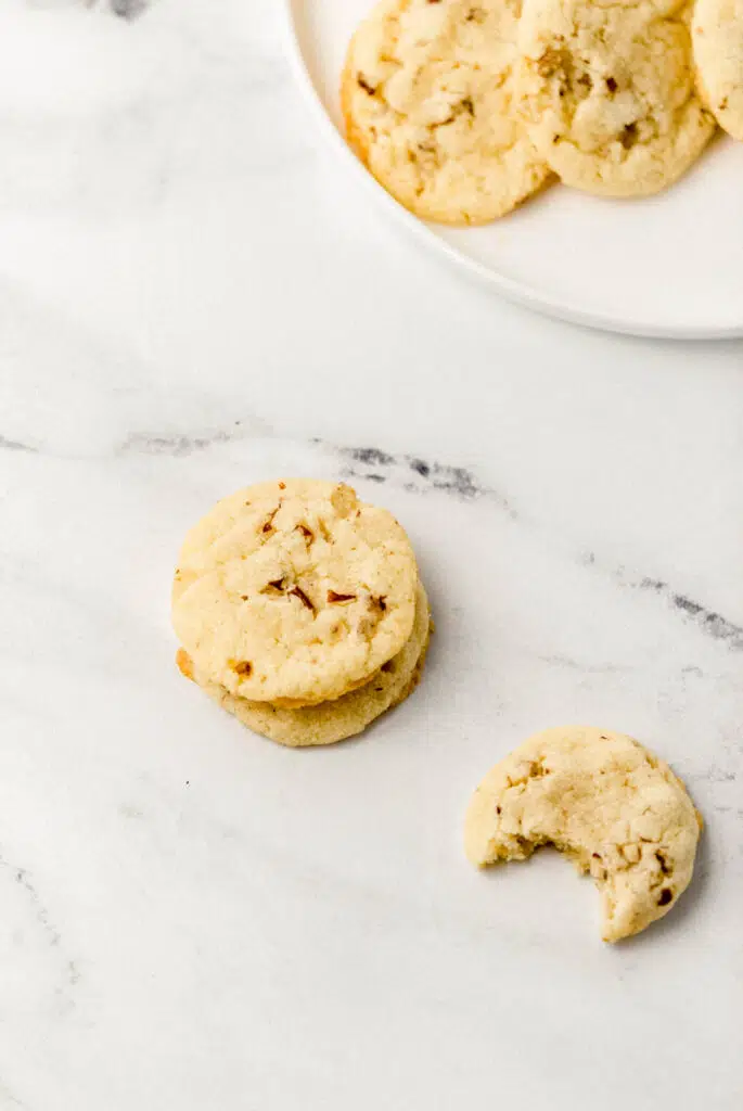 pecan cookies on white plate and marble surface 