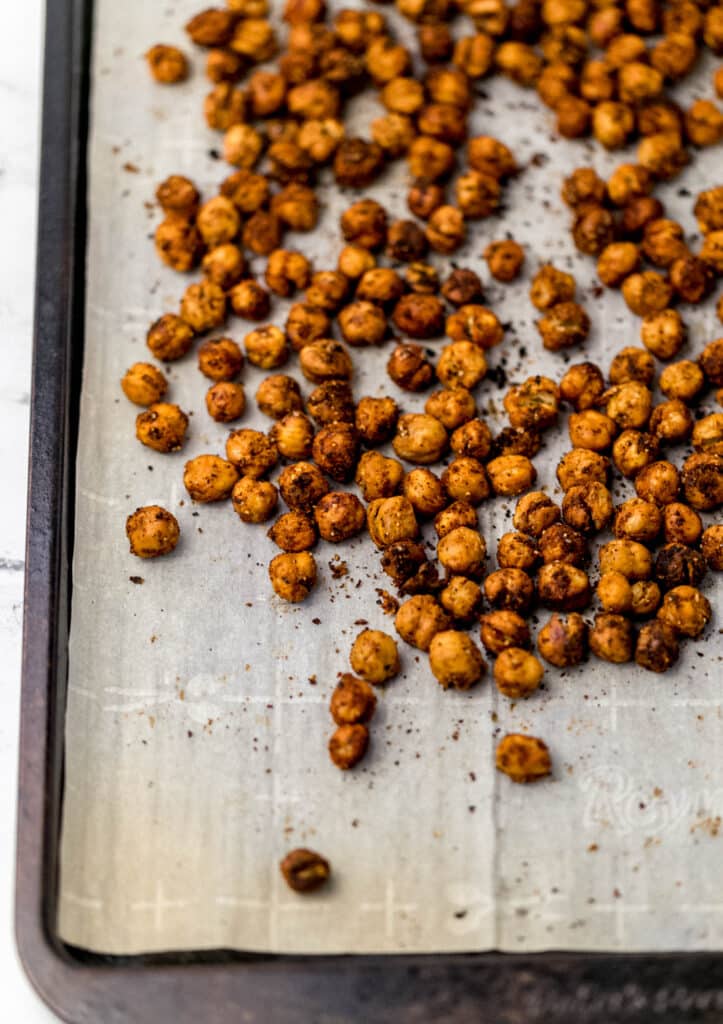 roasted chickpeas on parchment-lined baking sheet