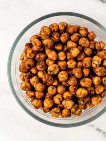 Glass bowl with finished chickpeas in it.