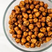 Glass bowl of roasted chickpeas on pin with text overlay.