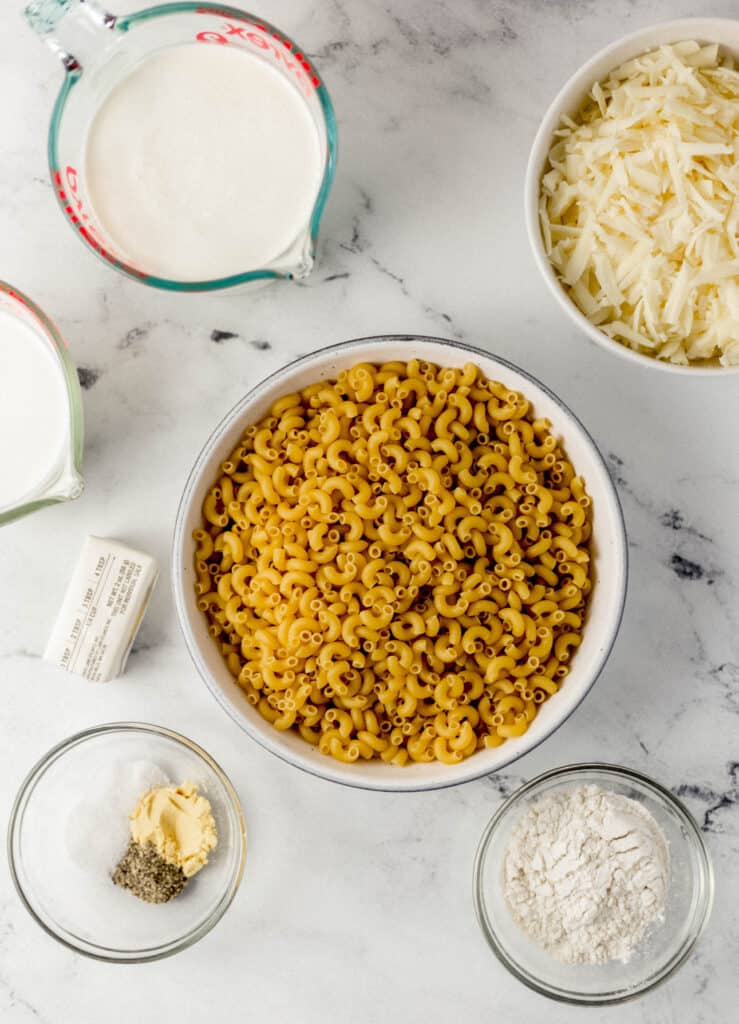 White Cheddar Mac and Cheese Ingredients overhead view of all ingredients on marble surface