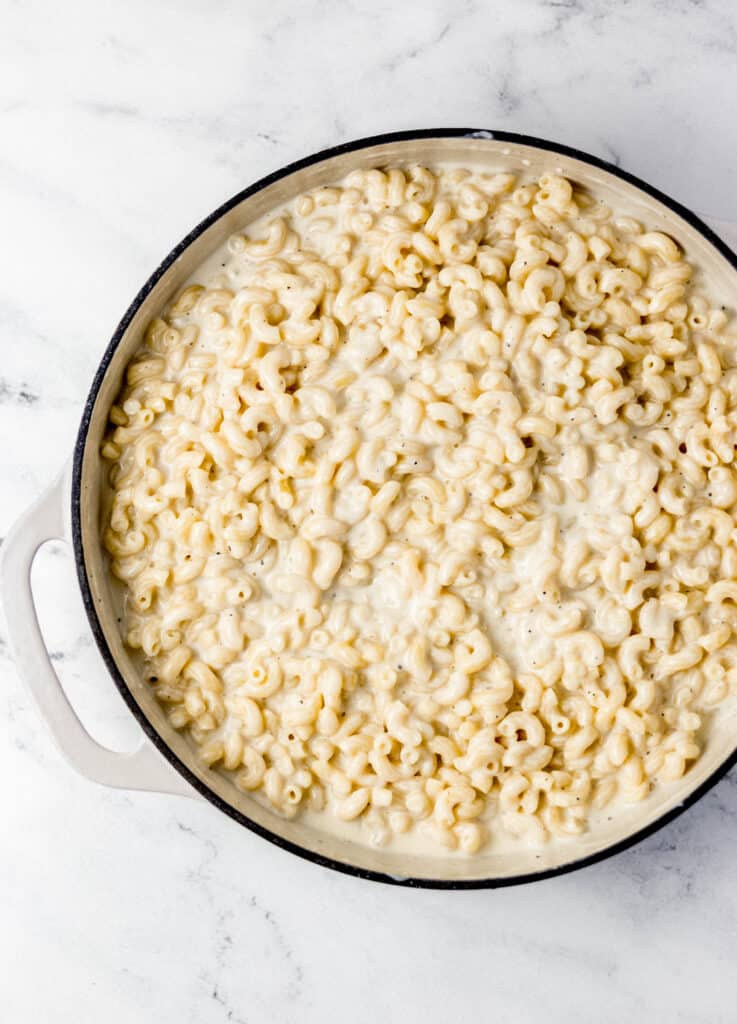 White Cheddar Mac and Cheese all ingredients to make mac and cheese combined in pan