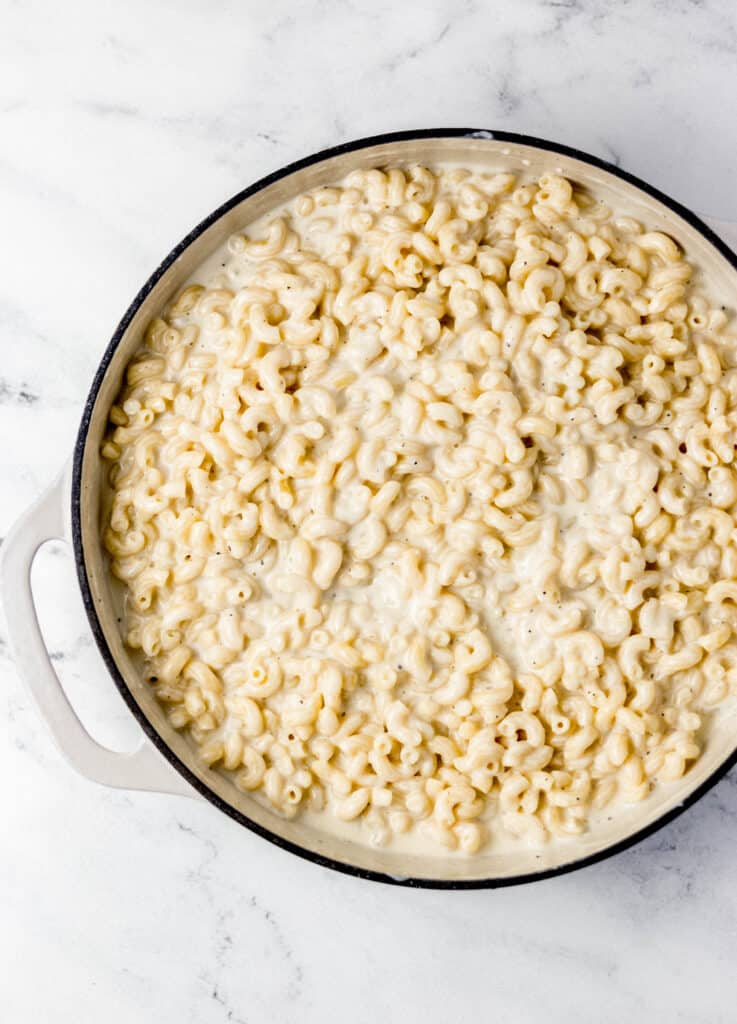 all ingredients to make mac and cheese combined in pan